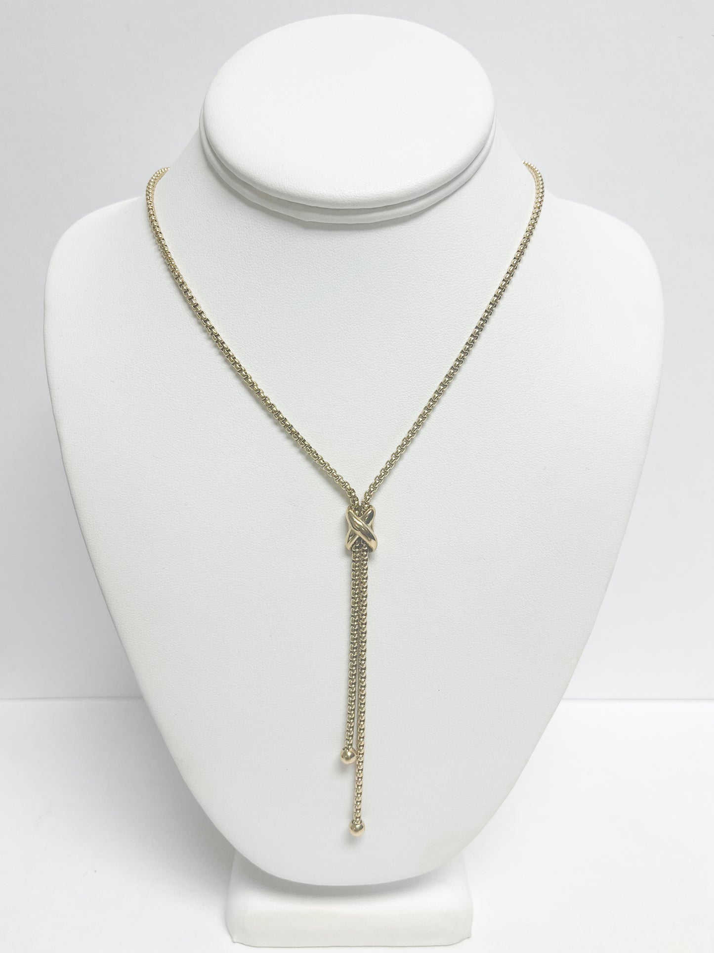 Cross tie pendant necklace