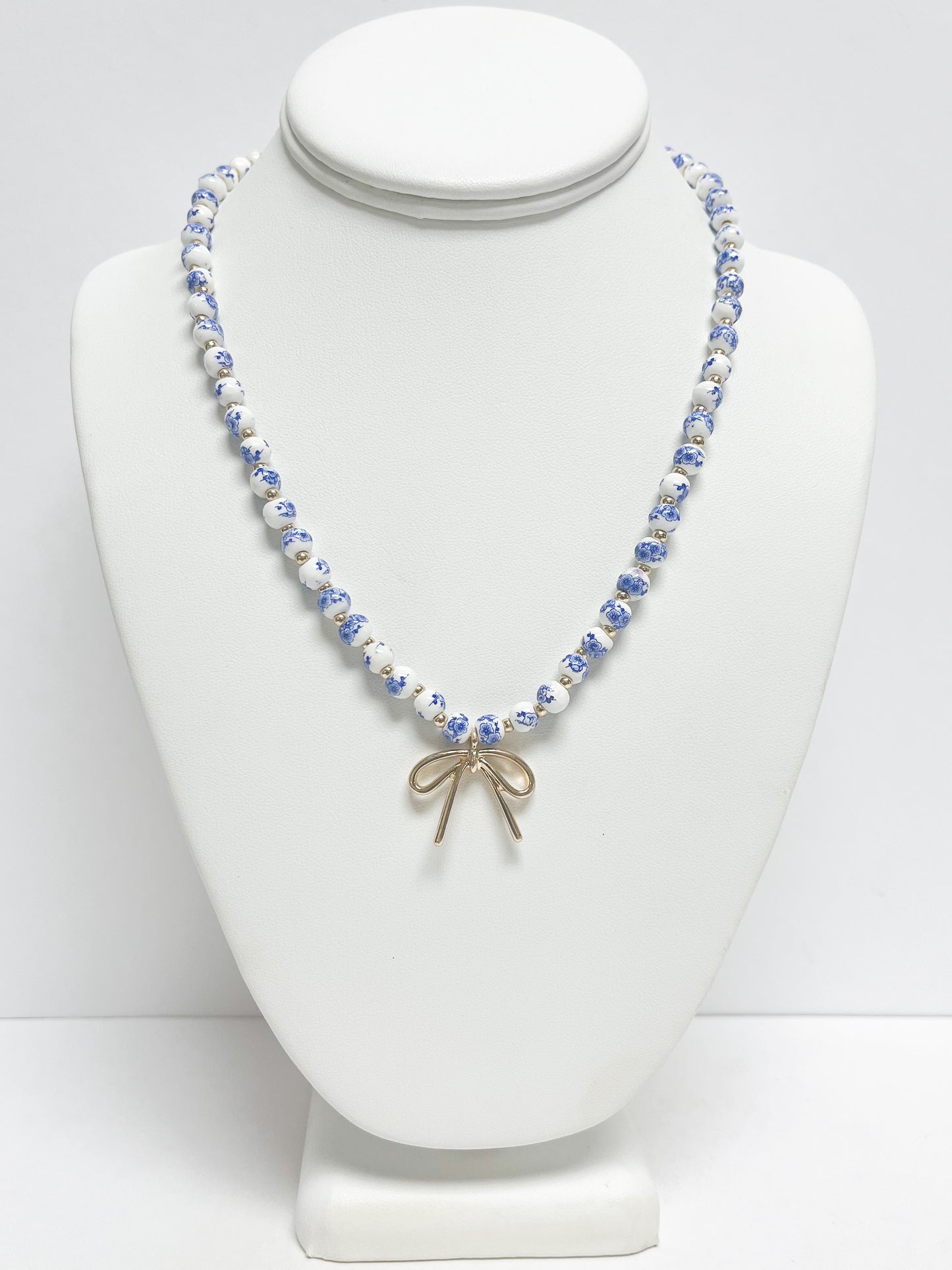Metal Bow Pendant Floral Printed Ceramic Ball Necklace