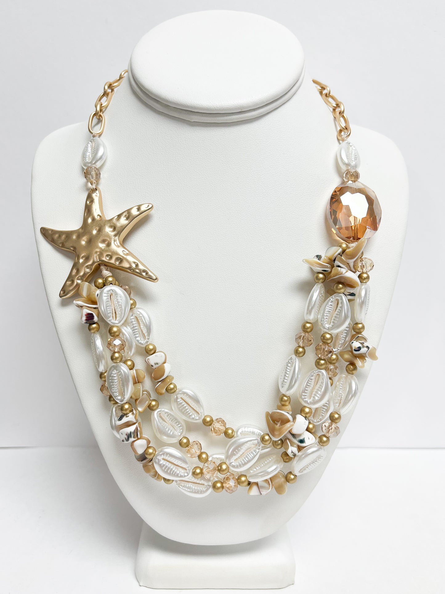 Layered white and gold sea charm necklace