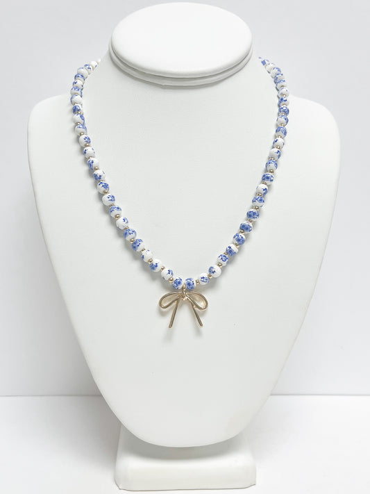 Metal Bow Pendant Floral Printed Ceramic Ball Necklace